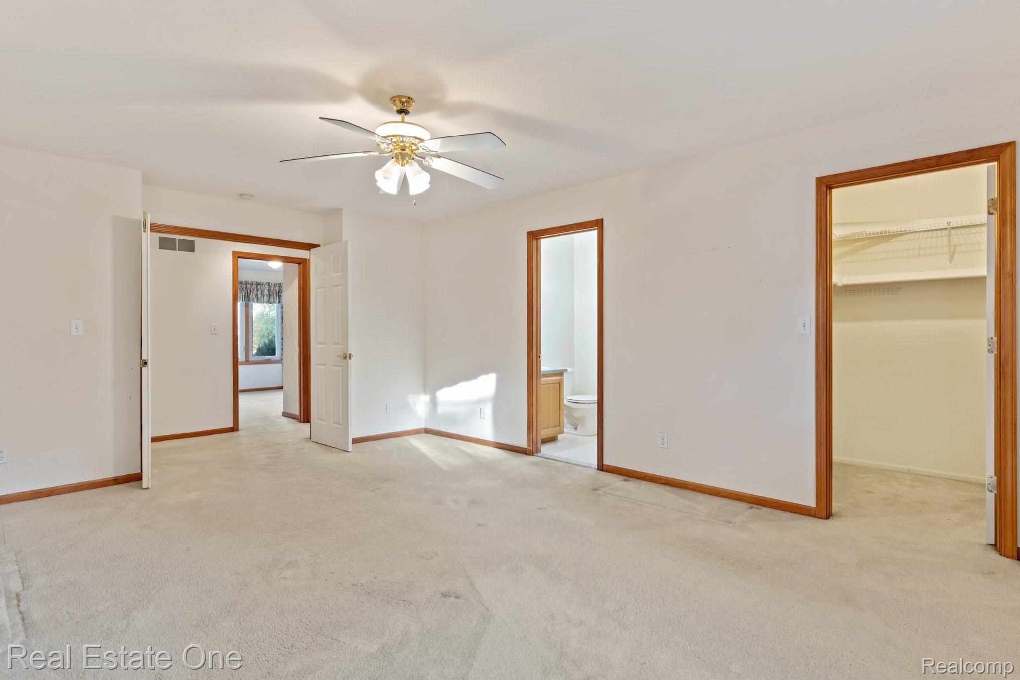 50009 Riverside Drive Macomb, MI 48044 - Photo 15 of 34 DOUBLE DOOR ENTRY TO MASTER BEDROOM. VIEW OF WAK IN CLOSET & BATHROOM