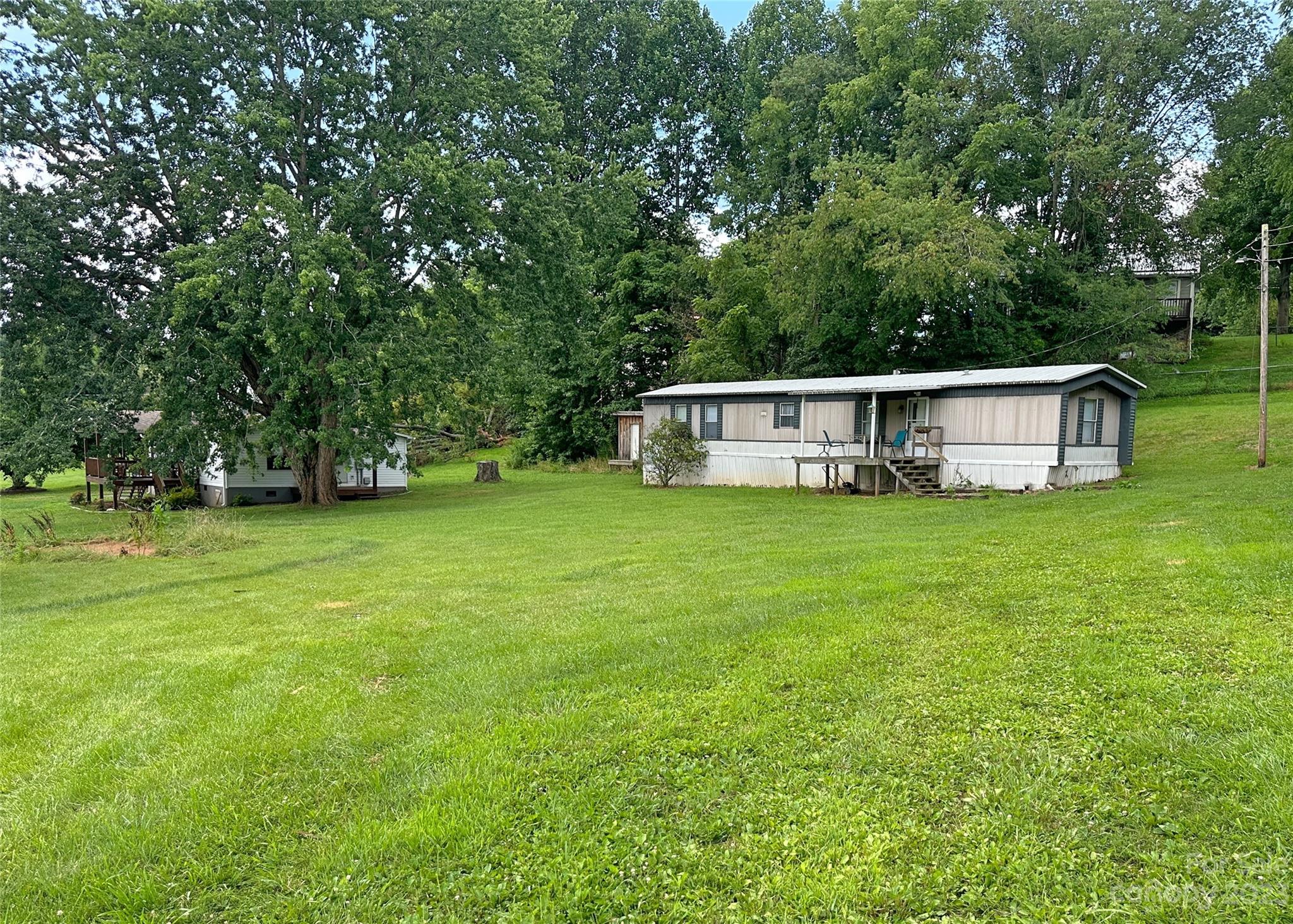 a view of a house with a big yard