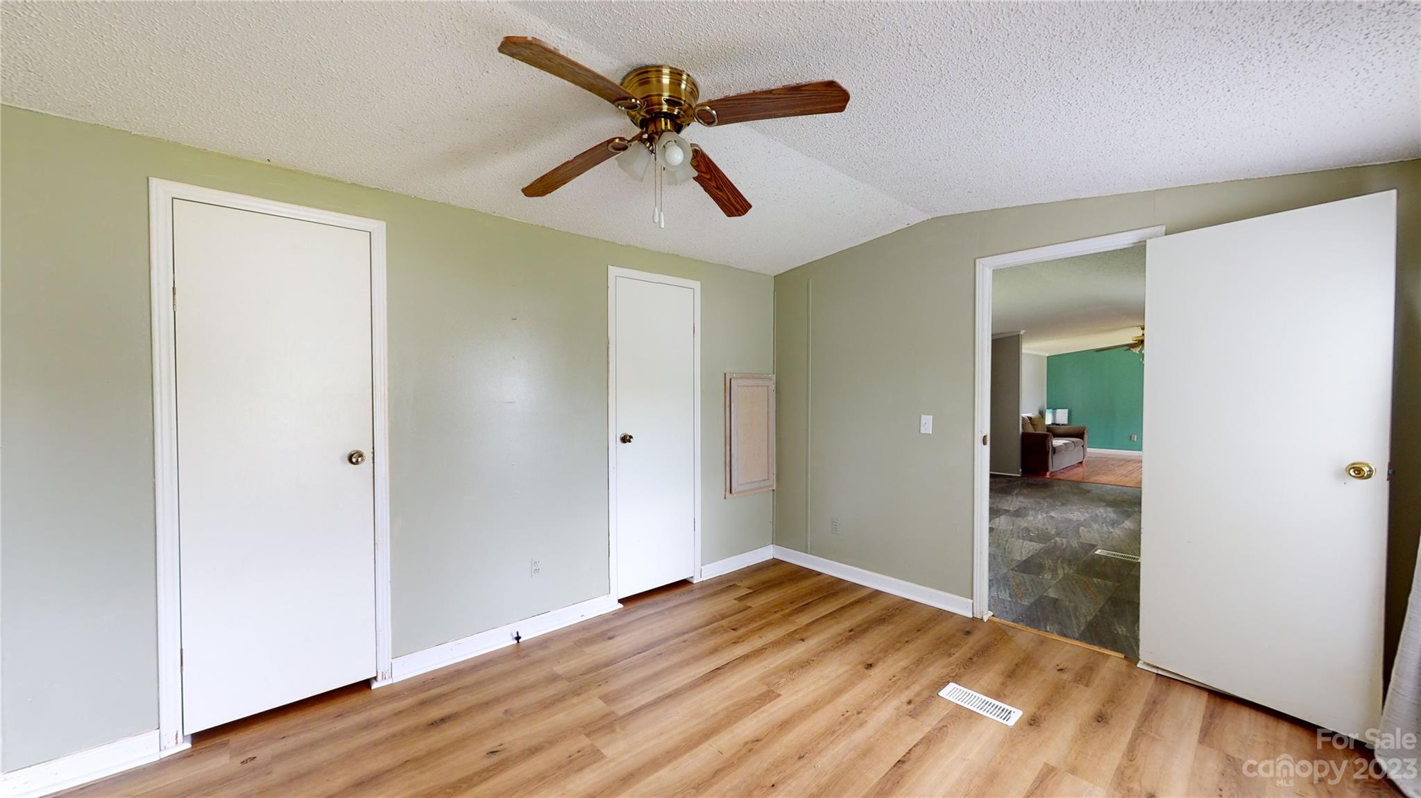 28 Thomas Lane Clyde, NC 28721 - Photo 6 of 9 a view of empty room with wooden floor