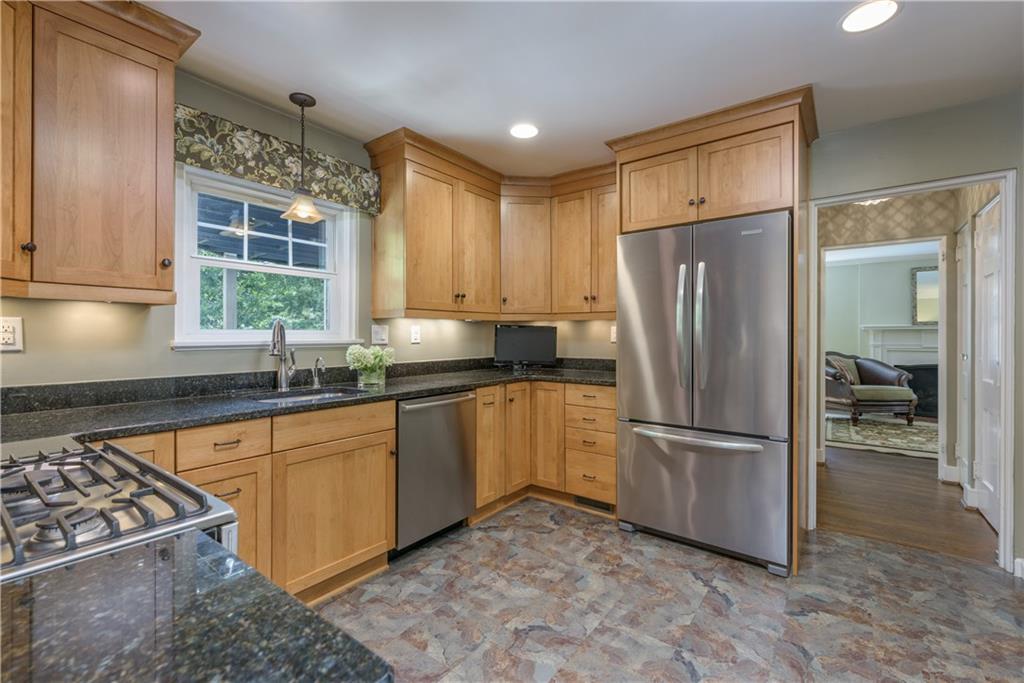 308 Maple Lane Sewickley, PA 15143 - Photo 14 of 25 a kitchen with a refrigerator and a sink