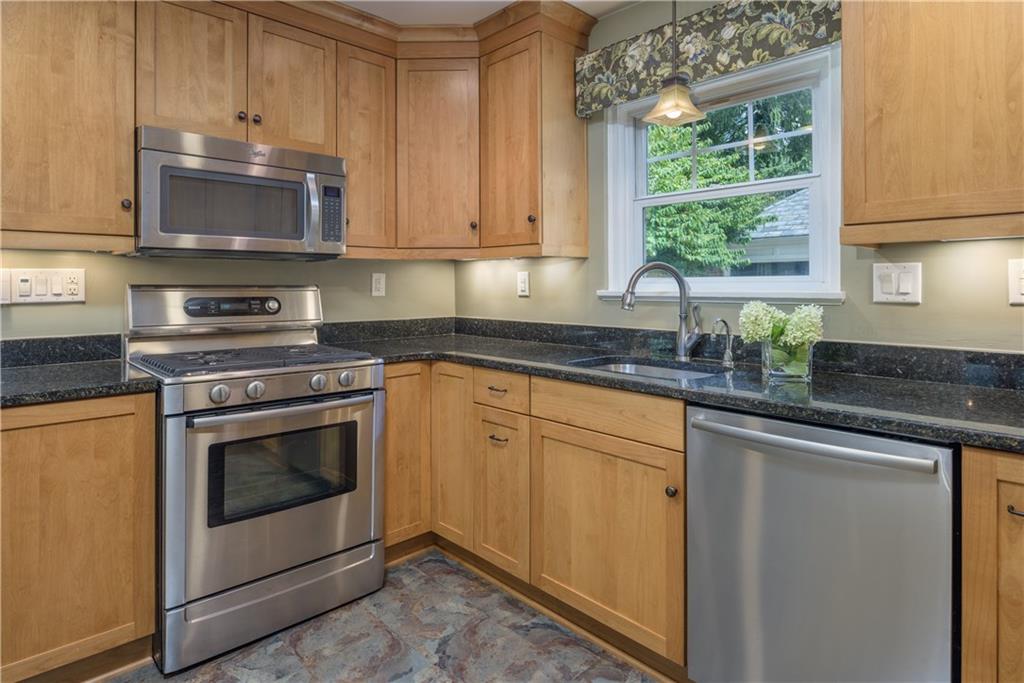 308 Maple Lane Sewickley, PA 15143 - Photo 15 of 25 a kitchen with stainless steel appliances granite countertop white cabinets a sink and a stove
