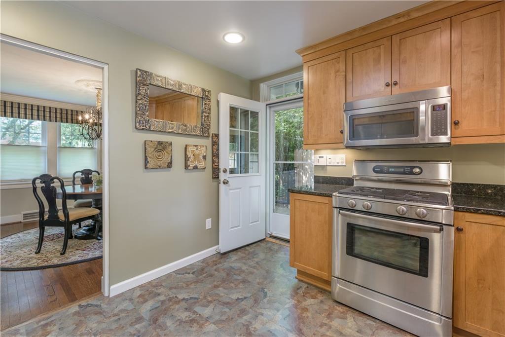 308 Maple Lane Sewickley, PA 15143 - Photo 16 of 25 a kitchen with granite countertop wooden cabinets and stainless steel appliances