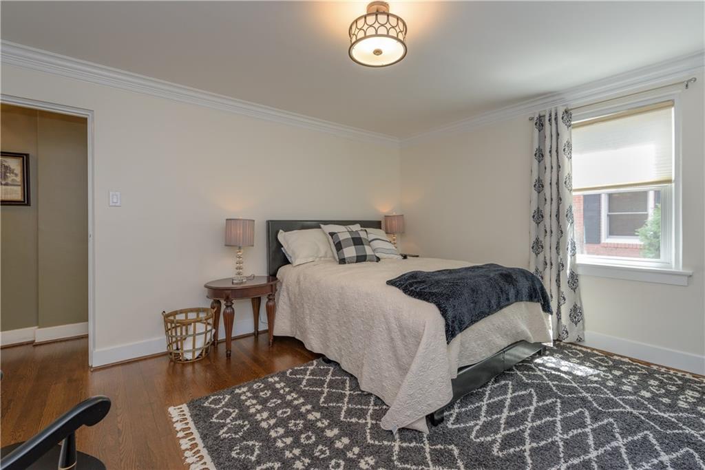 308 Maple Lane Sewickley, PA 15143 - Photo 22 of 25 a bedroom with a bed and wooden floor