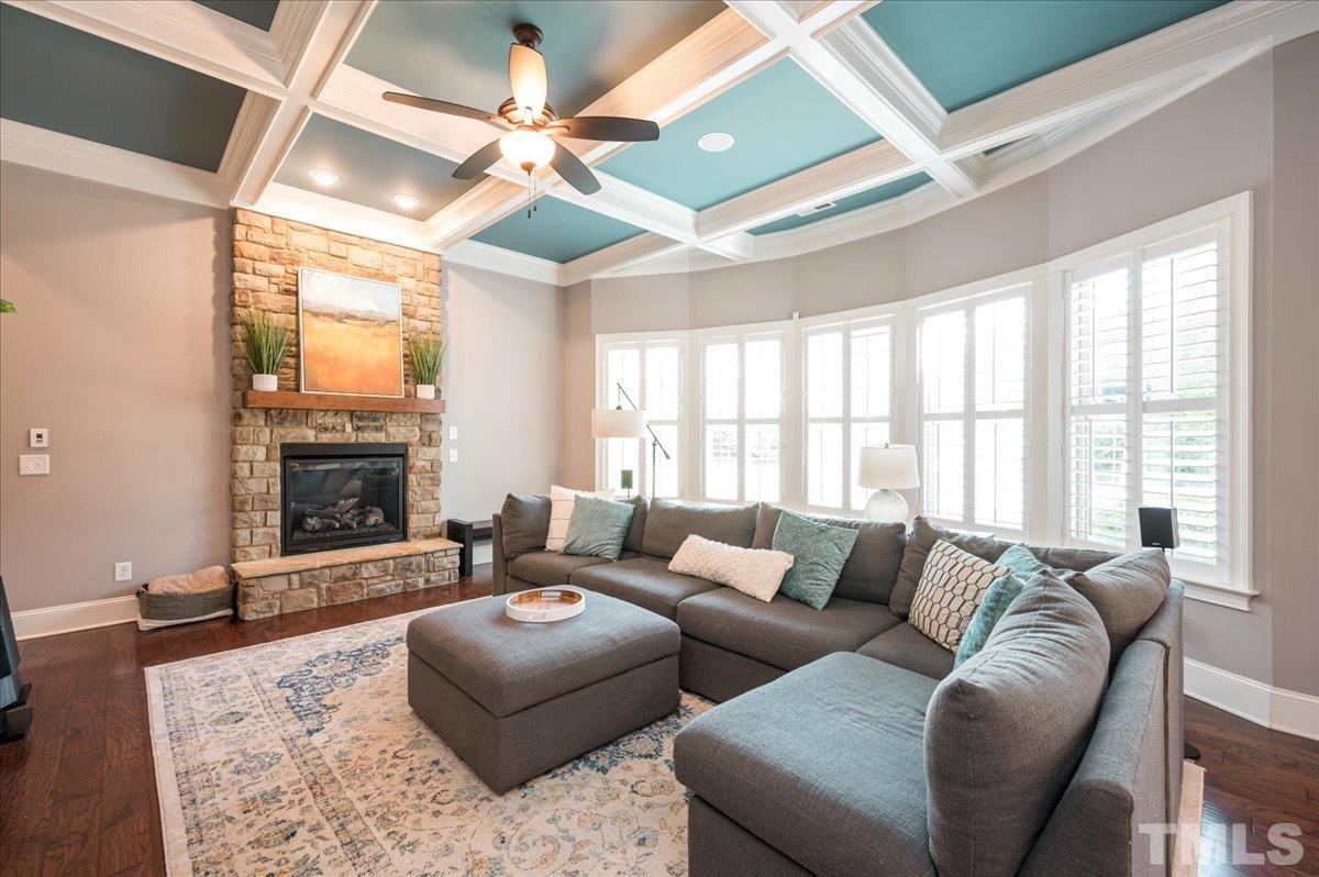5100 Gansett Lane Raleigh, NC 27612 - Photo 11 of 39 a living room with furniture and a fireplace