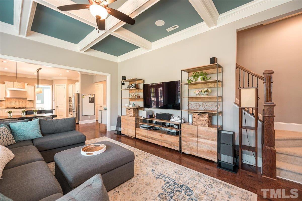 5100 Gansett Lane Raleigh, NC 27612 - Photo 13 of 39 a living room with furniture and a flat screen tv
