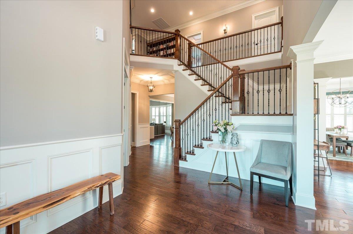 5100 Gansett Lane Raleigh, NC 27612 - Photo 16 of 39 a view of entryway and hall with wooden floor