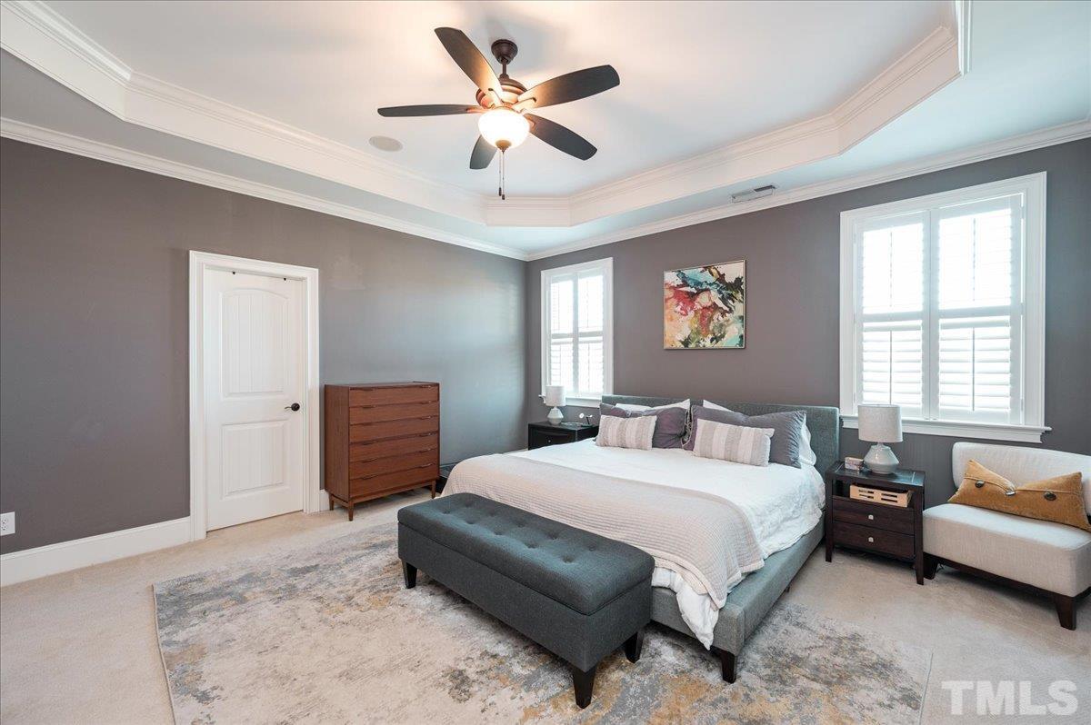 5100 Gansett Lane Raleigh, NC 27612 - Photo 17 of 39 a bedroom with a bed dresser and a window