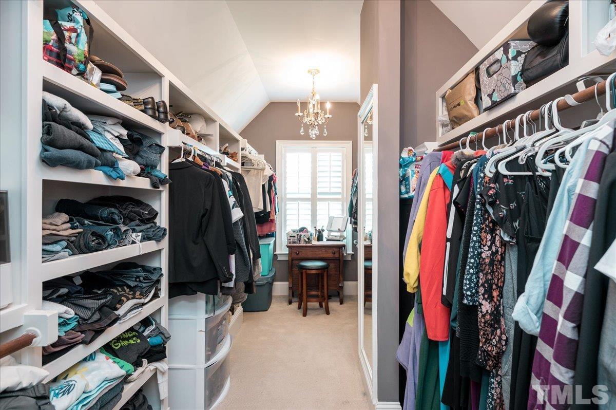 5100 Gansett Lane Raleigh, NC 27612 - Photo 20 of 39 a view of walk in closet with clothes and shoes