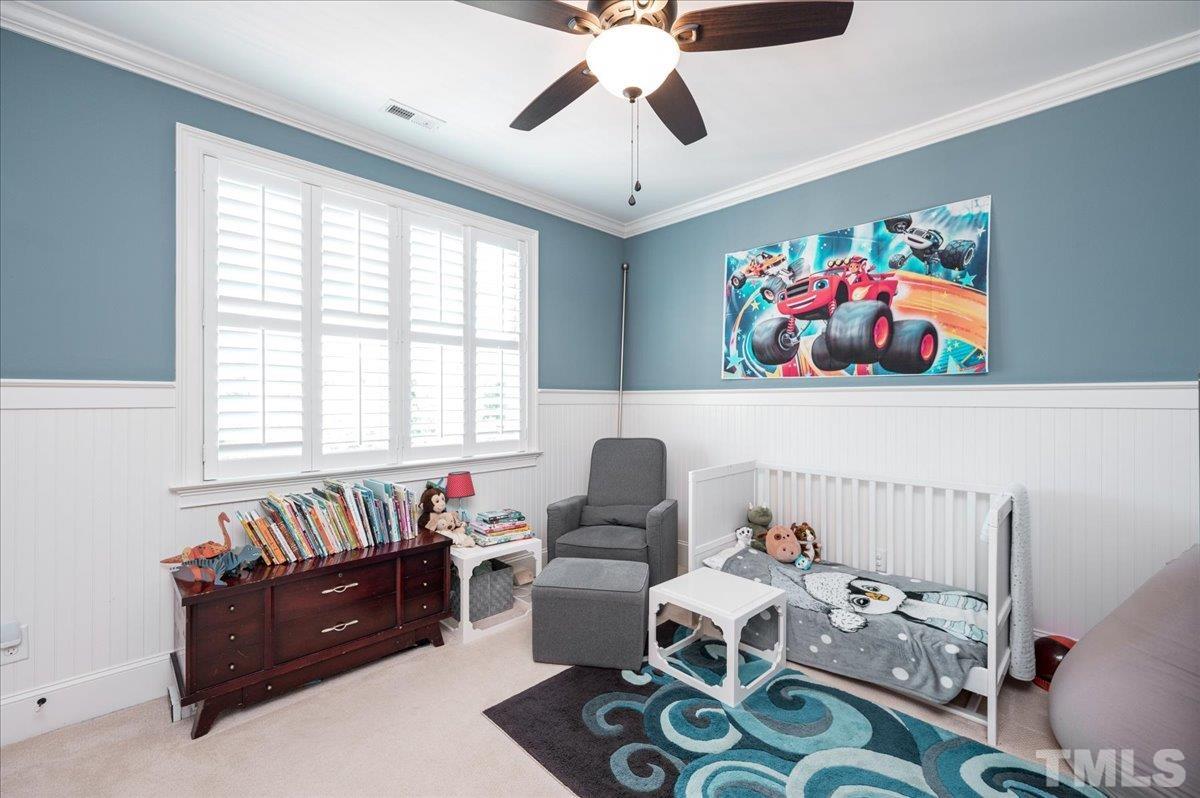 5100 Gansett Lane Raleigh, NC 27612 - Photo 24 of 39 a living room with furniture and a window