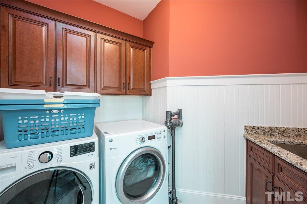 5100 Gansett Lane Raleigh, NC 27612 - Photo 27 of 39 a utility room with dryer and washer