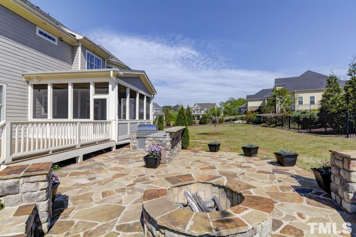 5100 Gansett Lane Raleigh, NC 27612 - Photo 32 of 39 a view of a house with backyard sitting area and garden