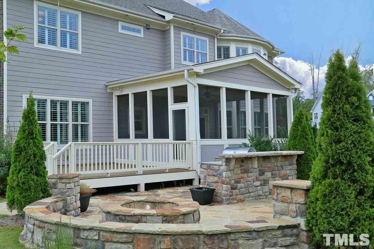5100 Gansett Lane Raleigh, NC 27612 - Photo 33 of 39 a view of a house with a small deck and a chair
