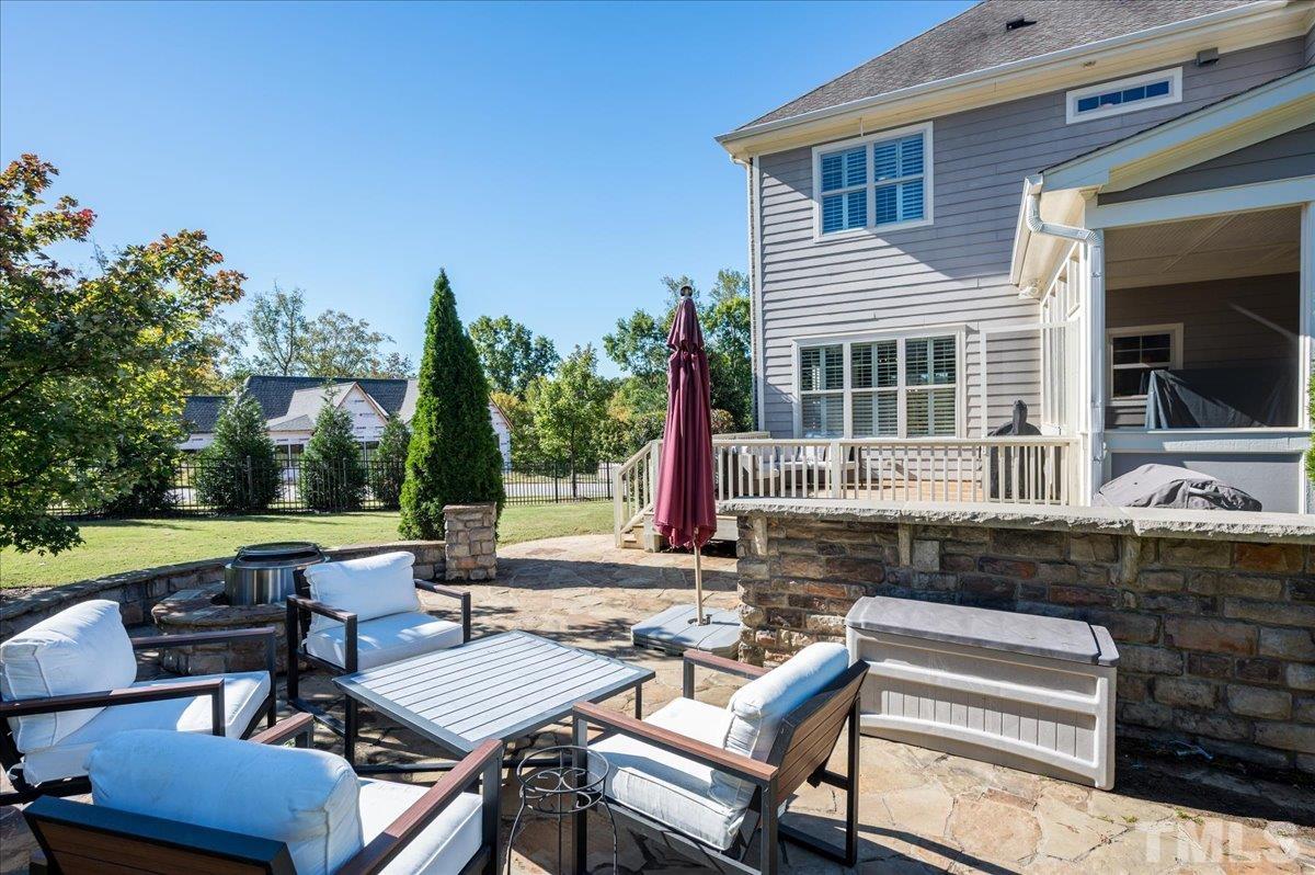 5100 Gansett Lane Raleigh, NC 27612 - Photo 34 of 39 a view of backyard with outdoor seating and green space