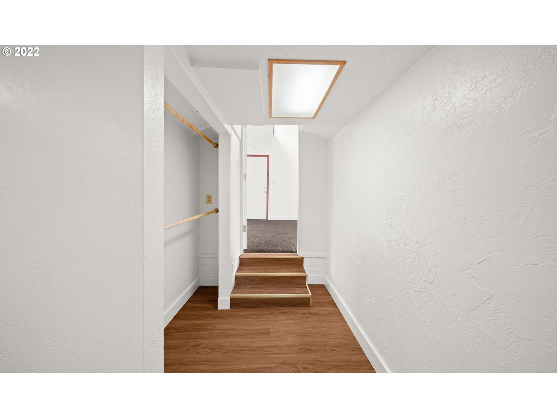 230 1/2 17th Street Springfield, OR 97477 - Photo 12 of 29 a hallway with stairs and wooden floor