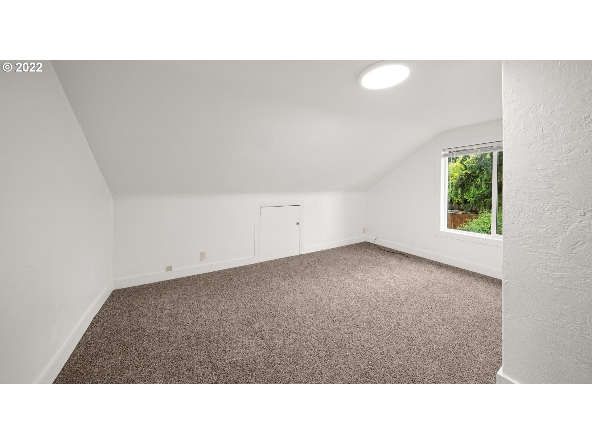 230 1/2 17th Street Springfield, OR 97477 - Photo 17 of 29 a open hall with a floor to ceiling window and a potted plant