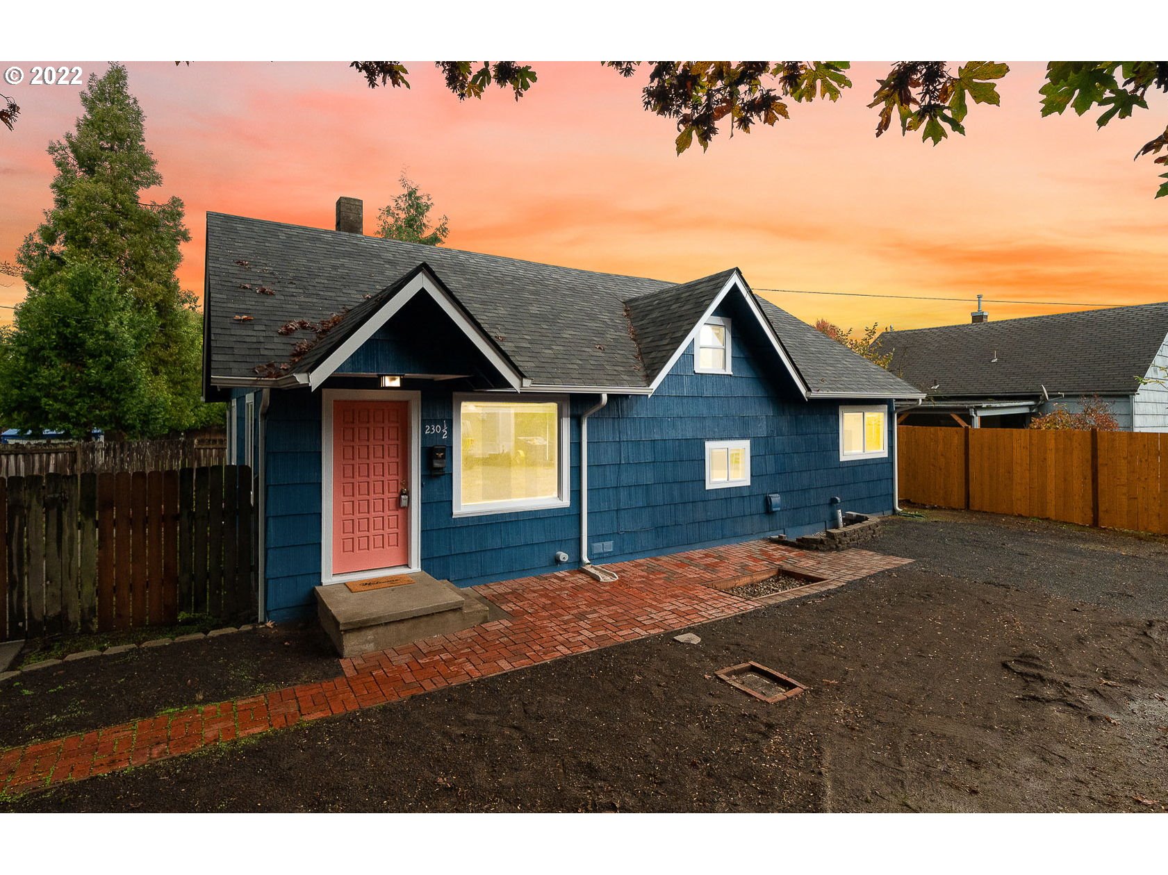 230 1/2 17th Street Springfield, OR 97477 - Photo 27 of 29 a front view of a house with a yard and garage