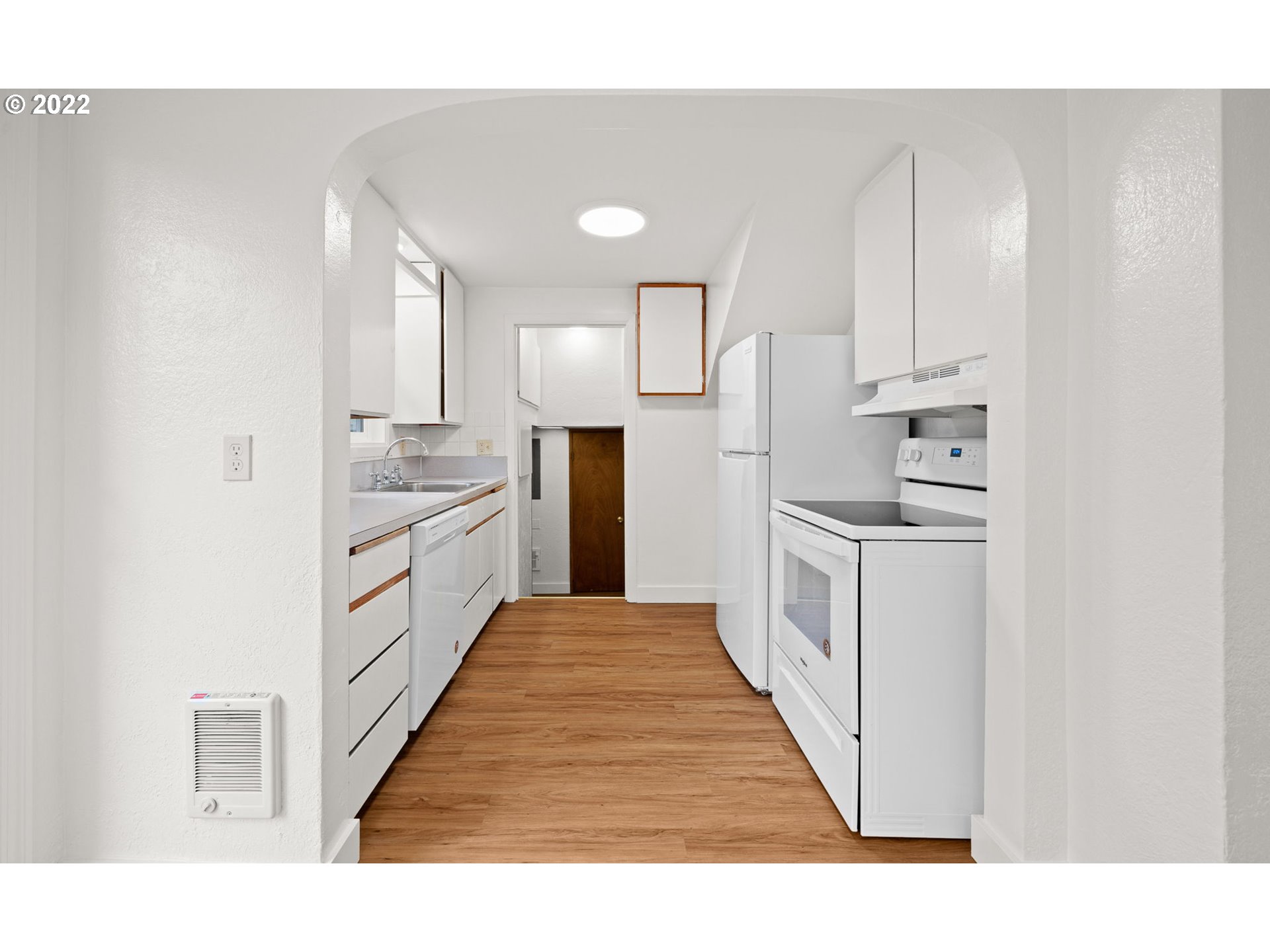 230 1/2 17th Street Springfield, OR 97477 - Photo 7 of 29 a open kitchen with white cabinets and white appliances