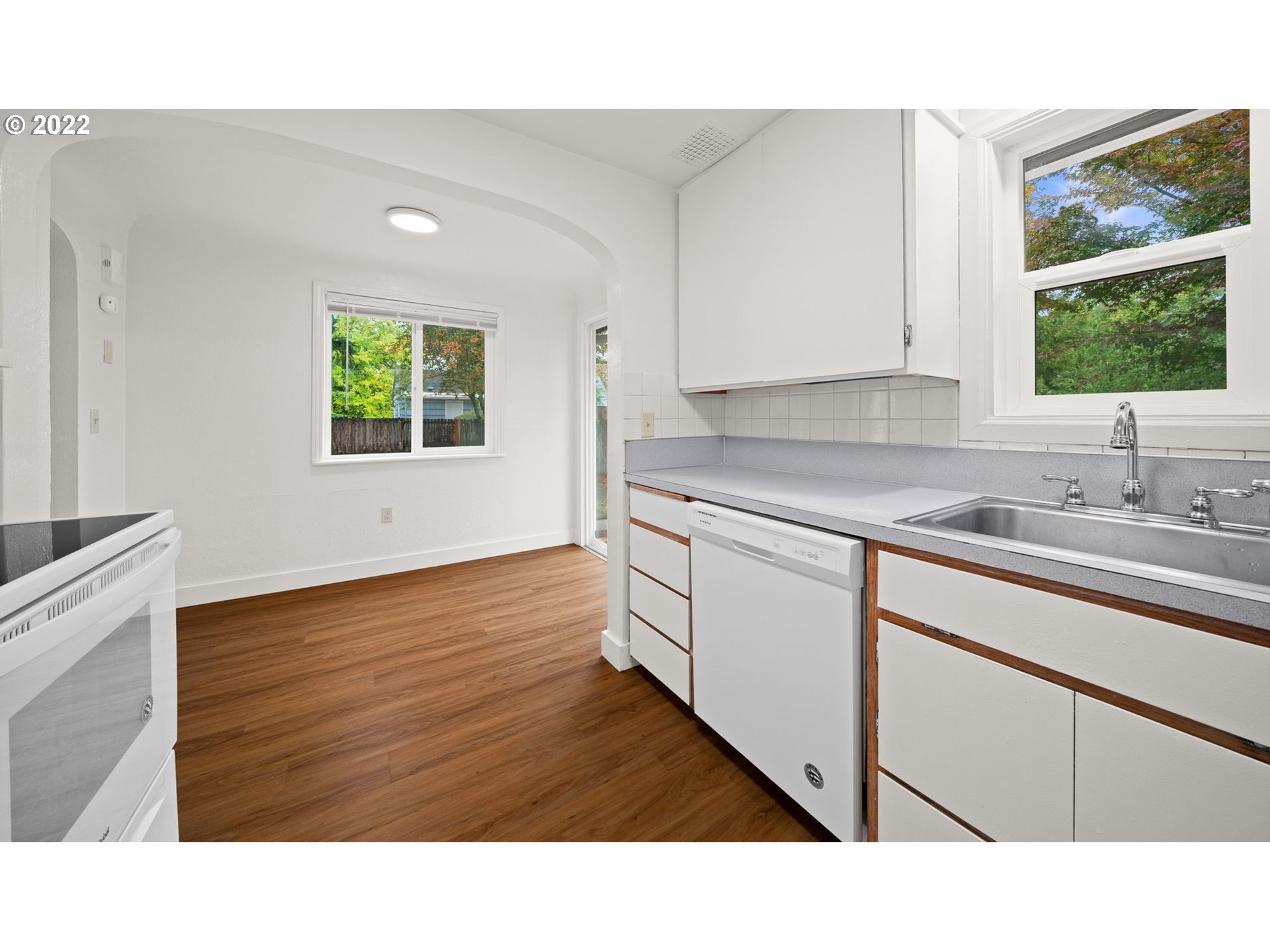 230 1/2 17th Street Springfield, OR 97477 - Photo 8 of 29 a kitchen with a sink window and cabinets