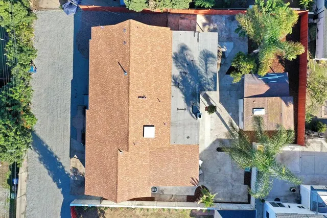 an aerial view of residential houses with outdoor space