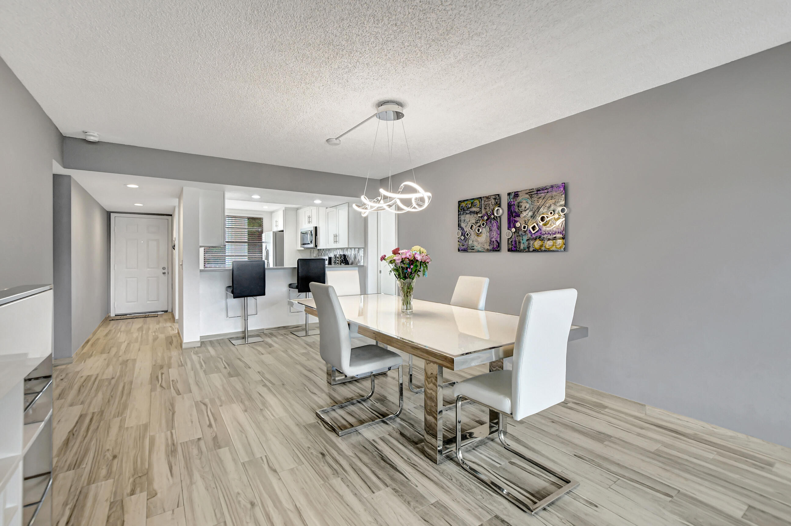6025 Balboa Circle, Unit 304 Boca Raton, FL 33433 - Photo 11 of 38 a living room with furniture and a table