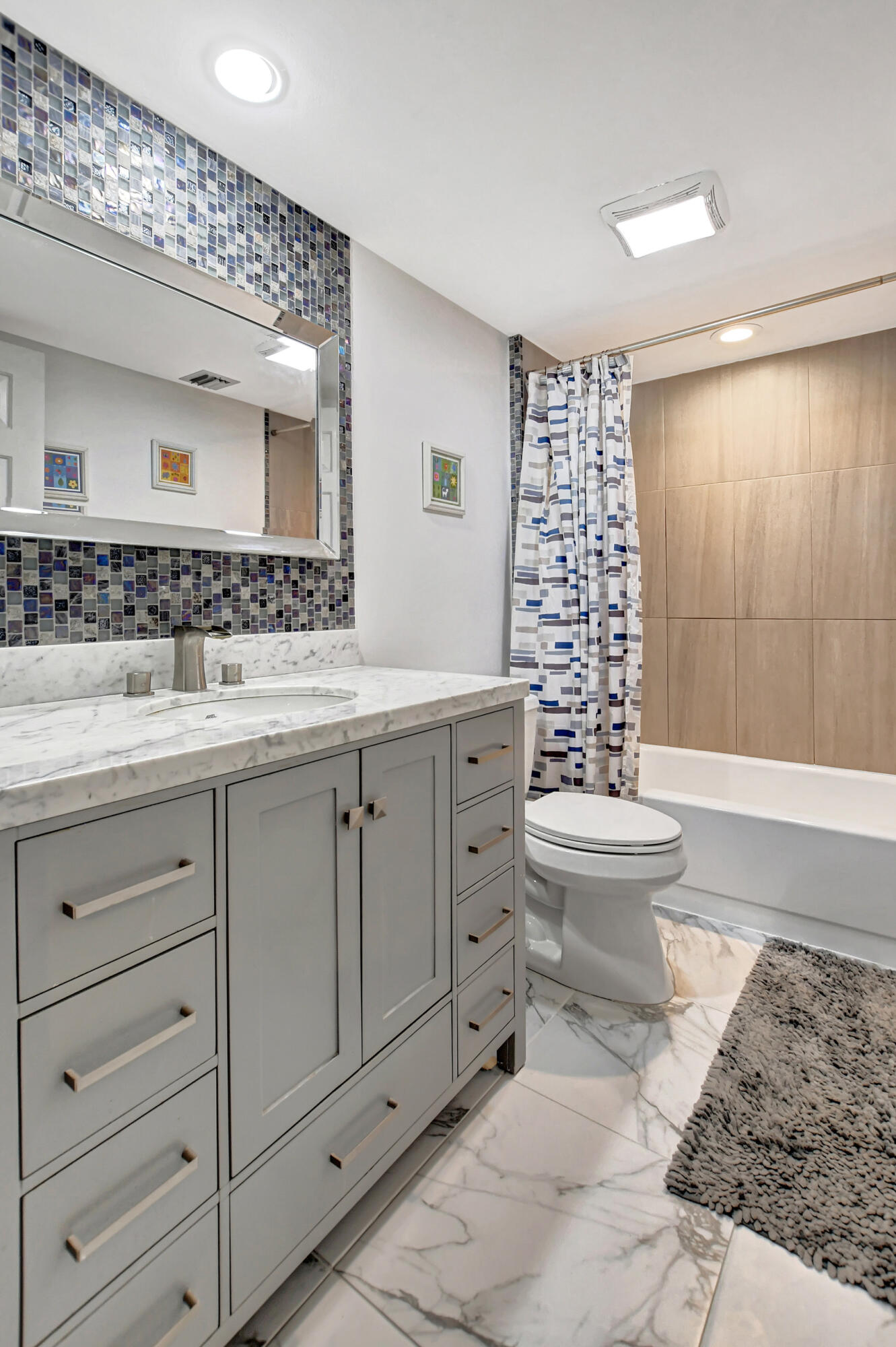 6025 Balboa Circle, Unit 304 Boca Raton, FL 33433 - Photo 19 of 38 a bathroom with a sink toilet and shower