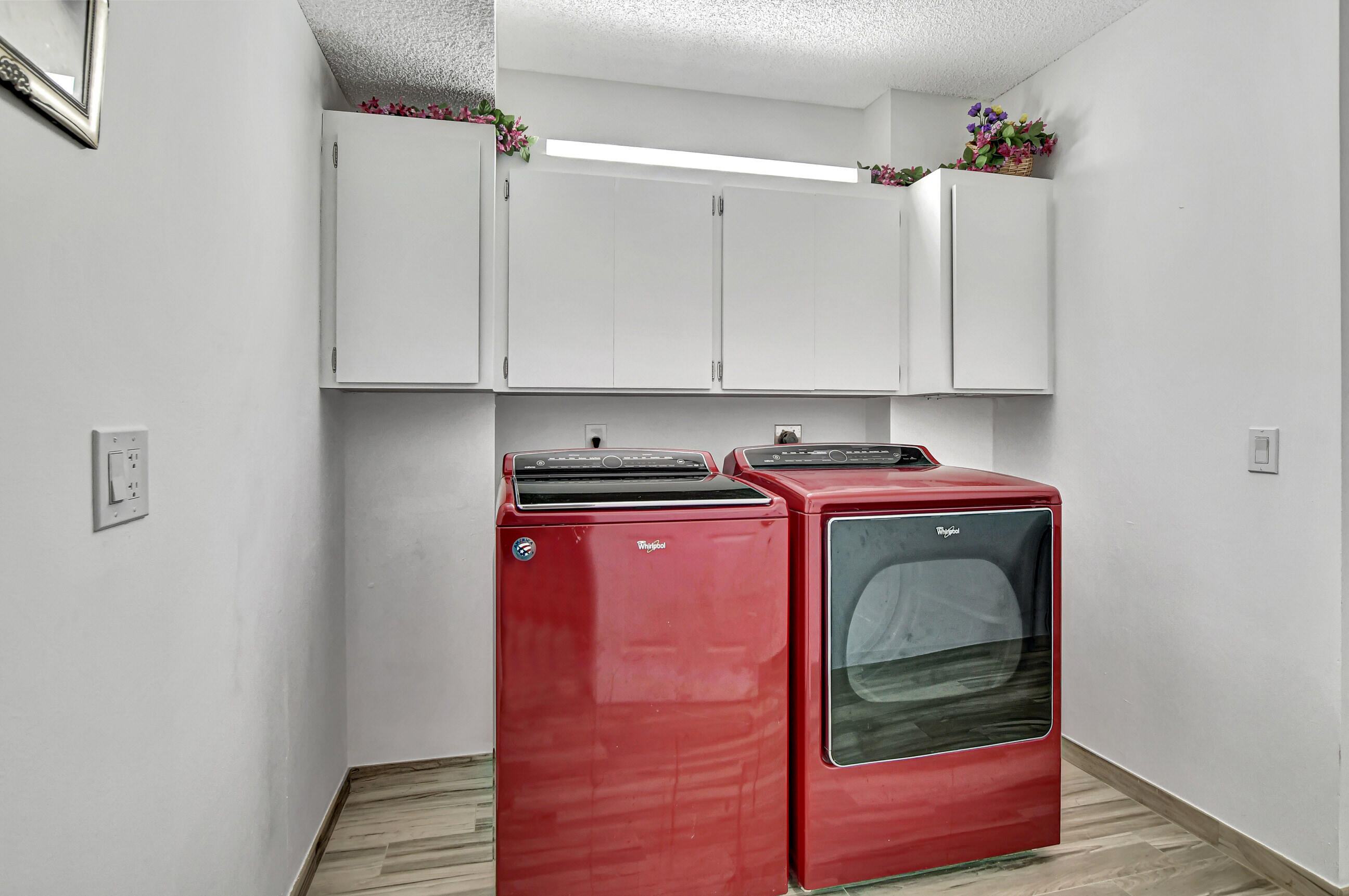 6025 Balboa Circle, Unit 304 Boca Raton, FL 33433 - Photo 23 of 38 a utility room with dryer and washer
