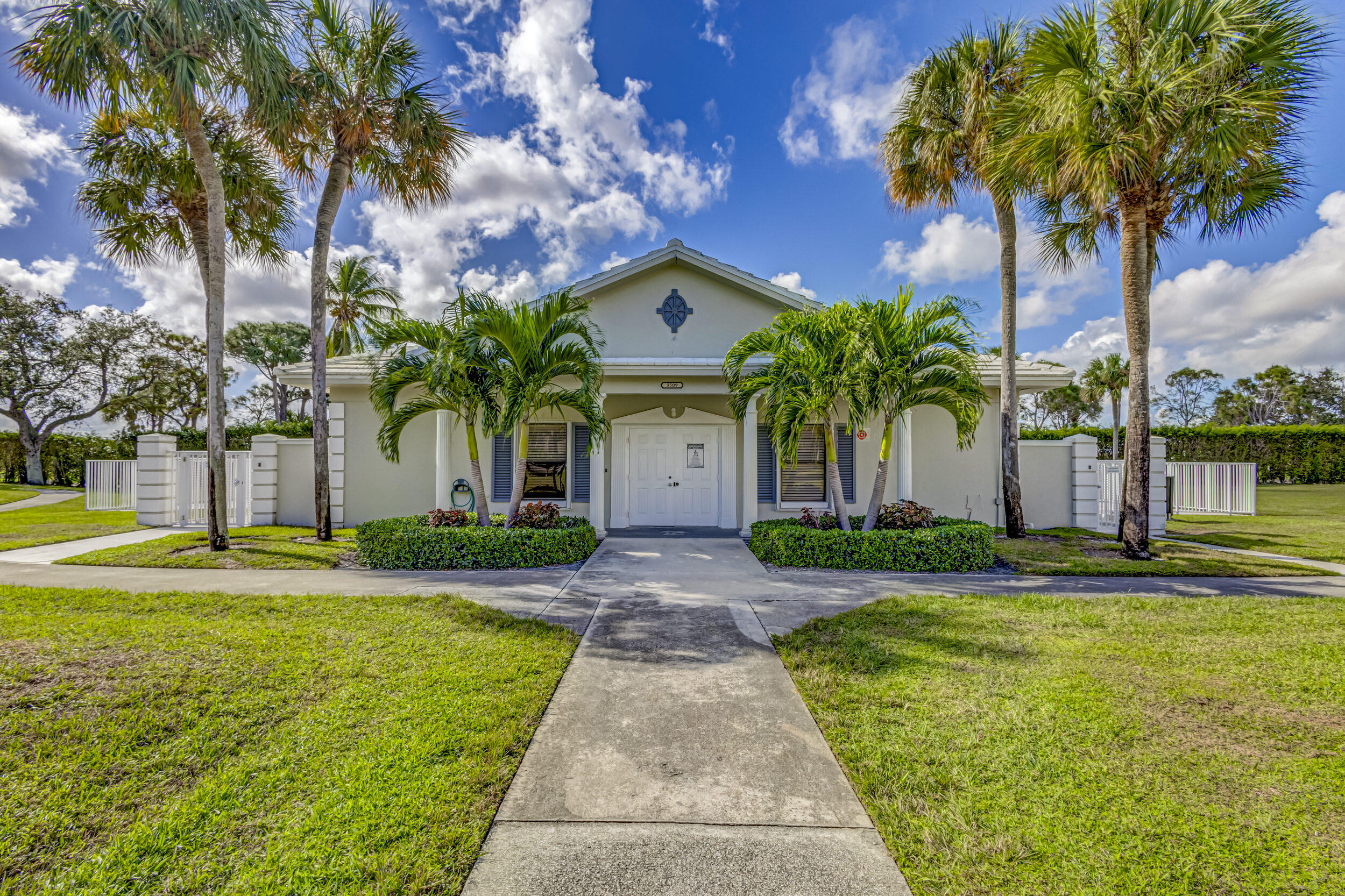 6025 Balboa Circle, Unit 304 Boca Raton, FL 33433 - Photo 33 of 38 a front view of a house with garden