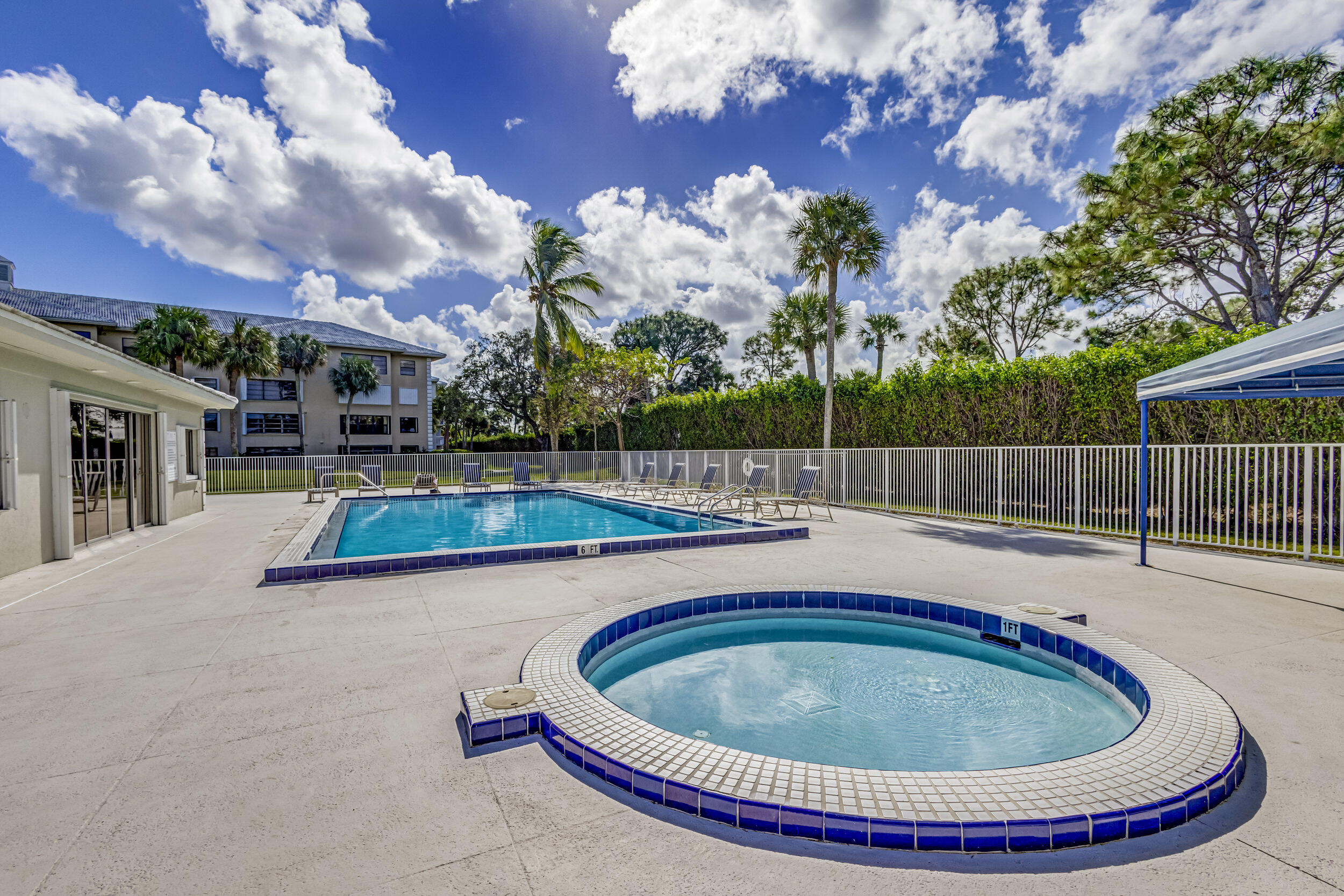 6025 Balboa Circle, Unit 304 Boca Raton, FL 33433 - Photo 36 of 38 a view of a swimming pool with a patio