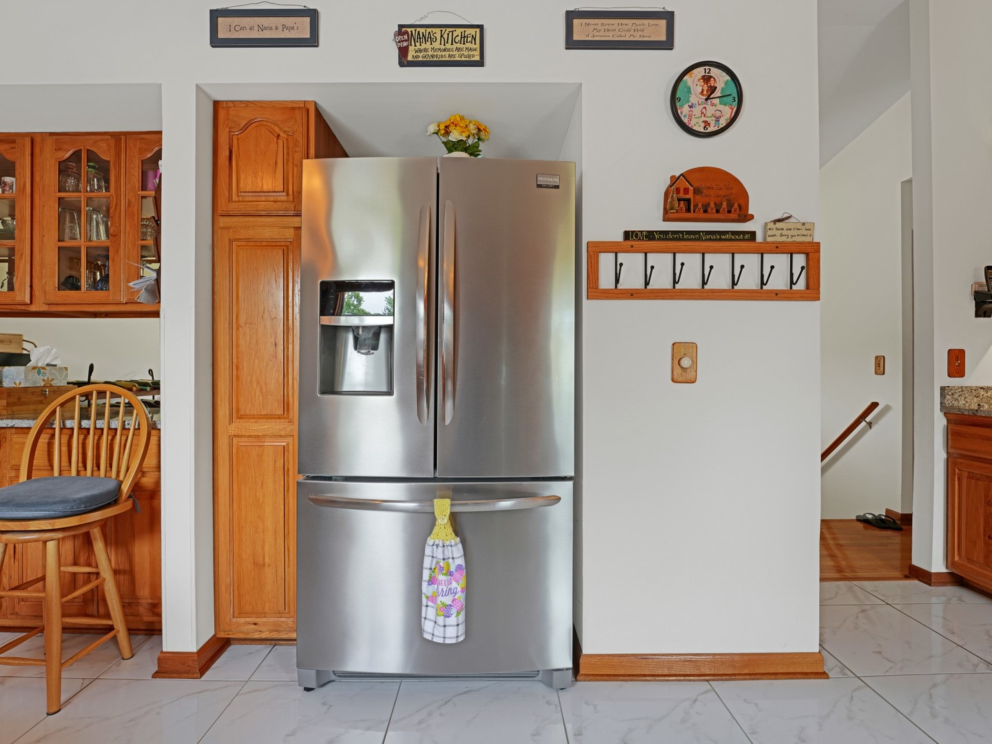 58 South Beck Road Lindenhurst, IL 60046 - Photo 11 of 37 a kitchen with a refrigerator and a table