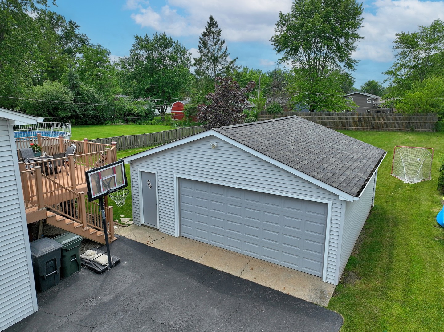 58 South Beck Road Lindenhurst, IL 60046 - Photo 6 of 37 a view of backyard with deck and garden