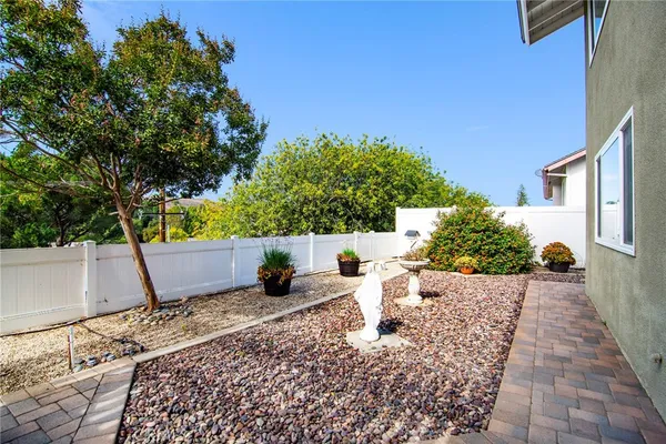 a view of a backyard with sitting area