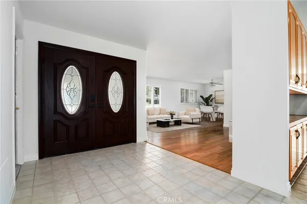 a view of a livingroom with furniture mirror and window