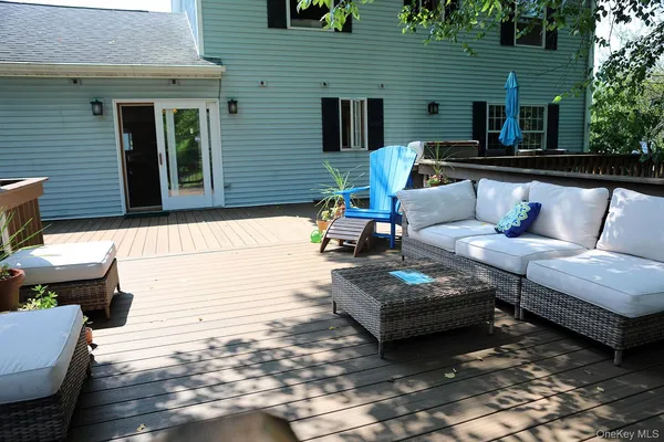 a view of a patio with couches chairs and a table