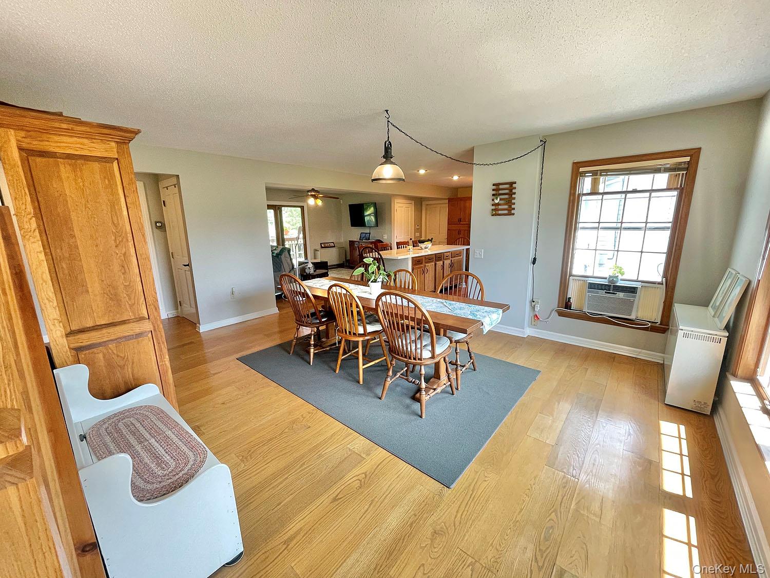 59 Delaware Drive Damascus, PA 18415 - Photo 12 of 24 a living room with furniture dining table and a large window
