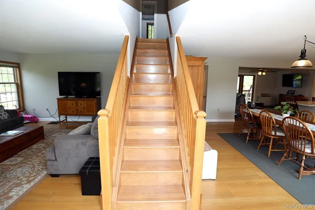 a view of living room filled with furniture and a flat screen tv
