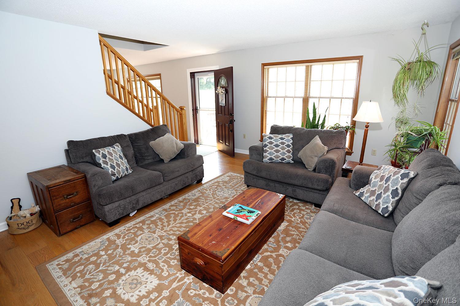 59 Delaware Drive Damascus, PA 18415 - Photo 17 of 24 a living room with furniture and a large window