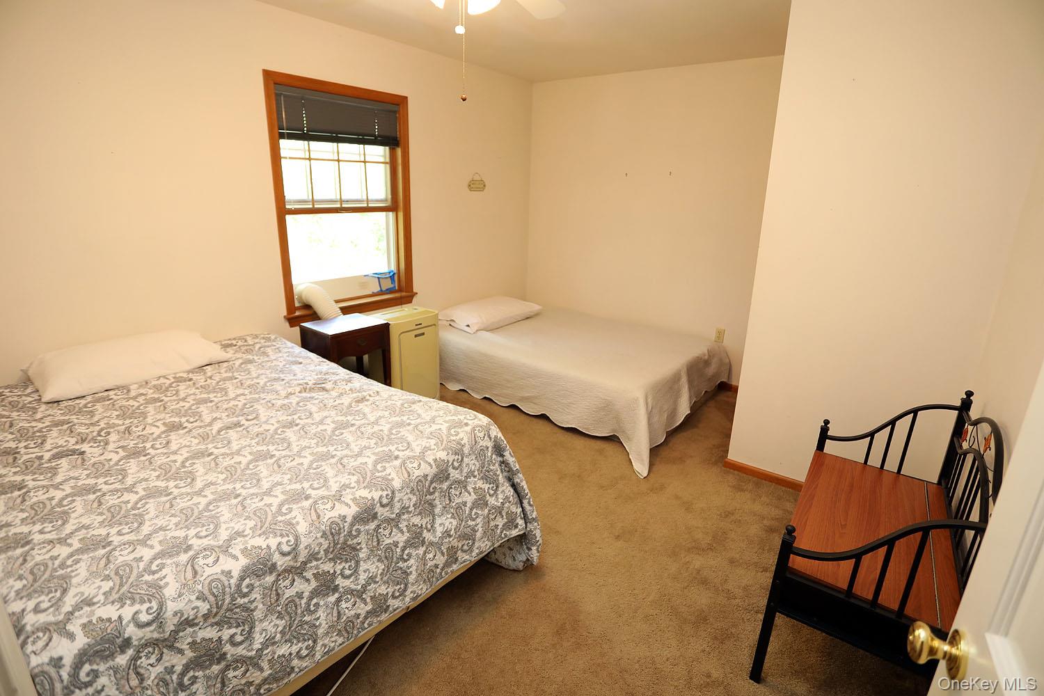 59 Delaware Drive Damascus, PA 18415 - Photo 19 of 24 a bedroom with two beds and a window