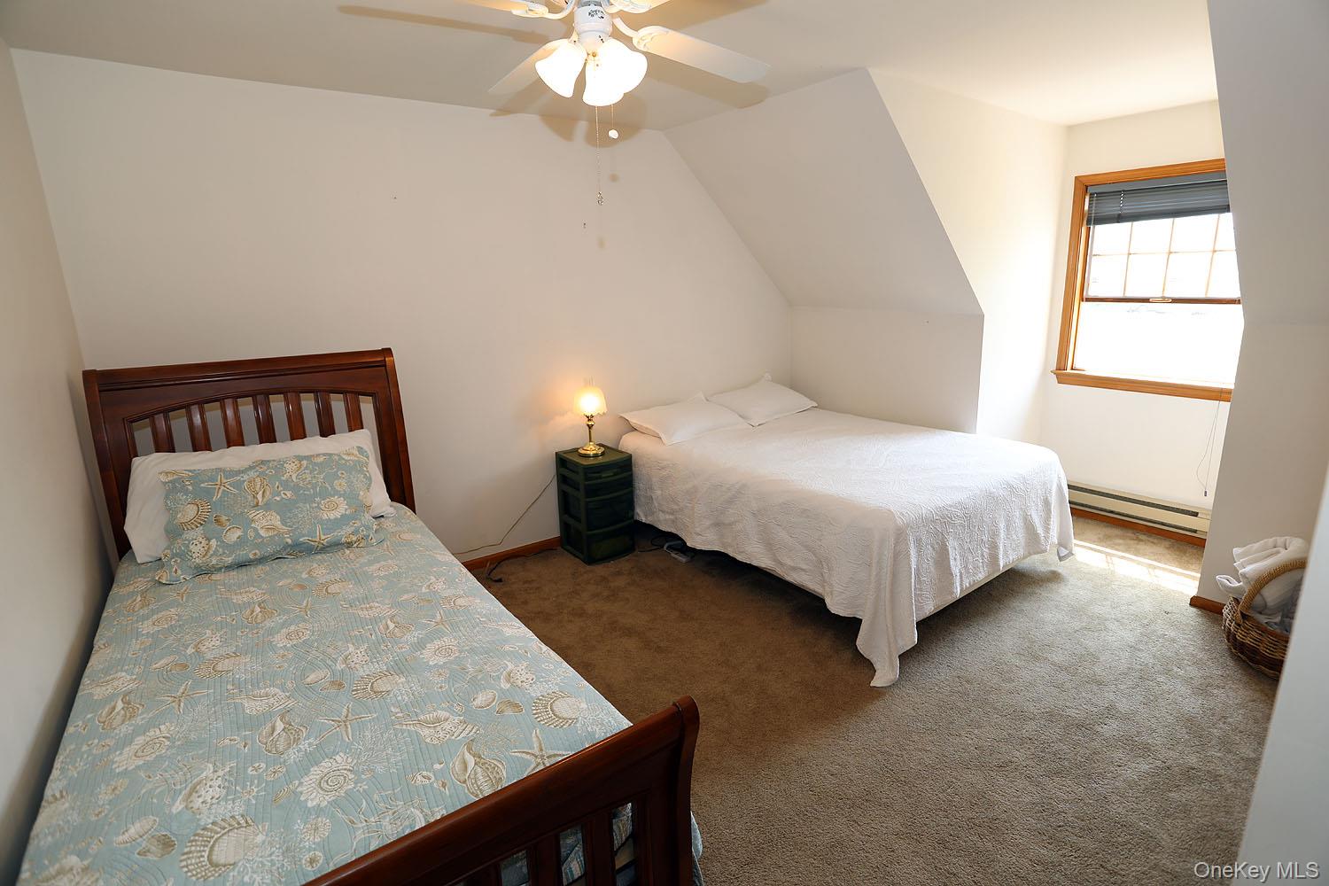 59 Delaware Drive Damascus, PA 18415 - Photo 20 of 24 a bedroom with a bed and a chandelier