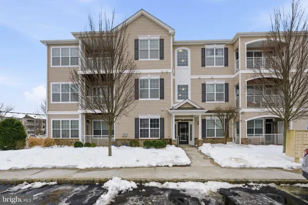 a view of a building with a yard