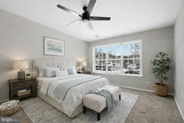 a bedroom with a bed furniture and a window