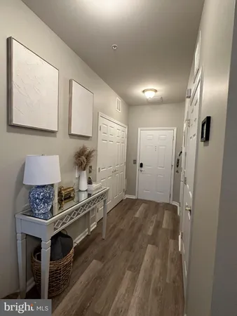 a kitchen with stainless steel appliances a stove a refrigerator and cabinets