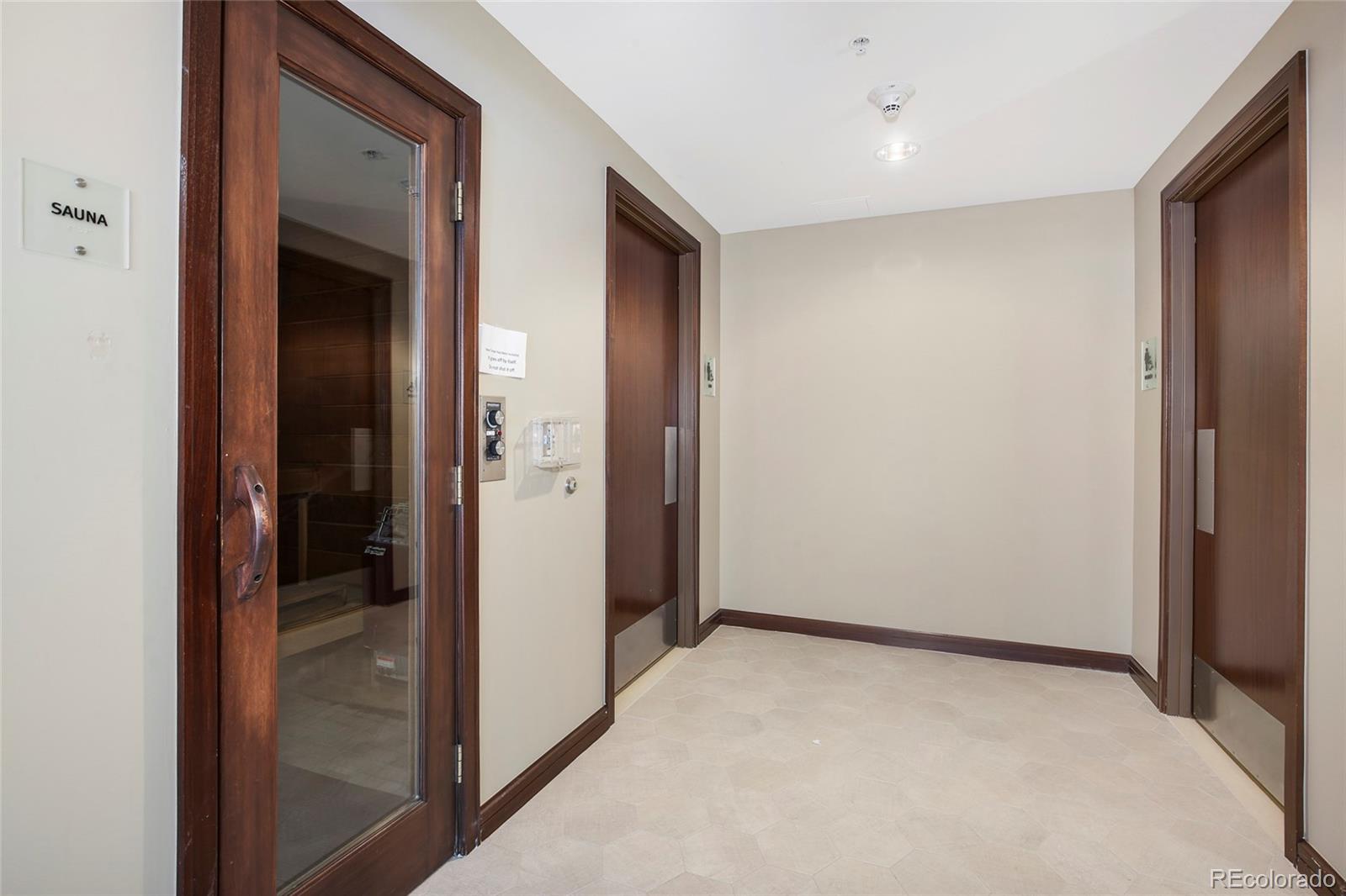 1650 Fillmore Street, Unit 1107 Denver, CO 80206 - Photo 43 of 49 a view of hallway with wooden floor