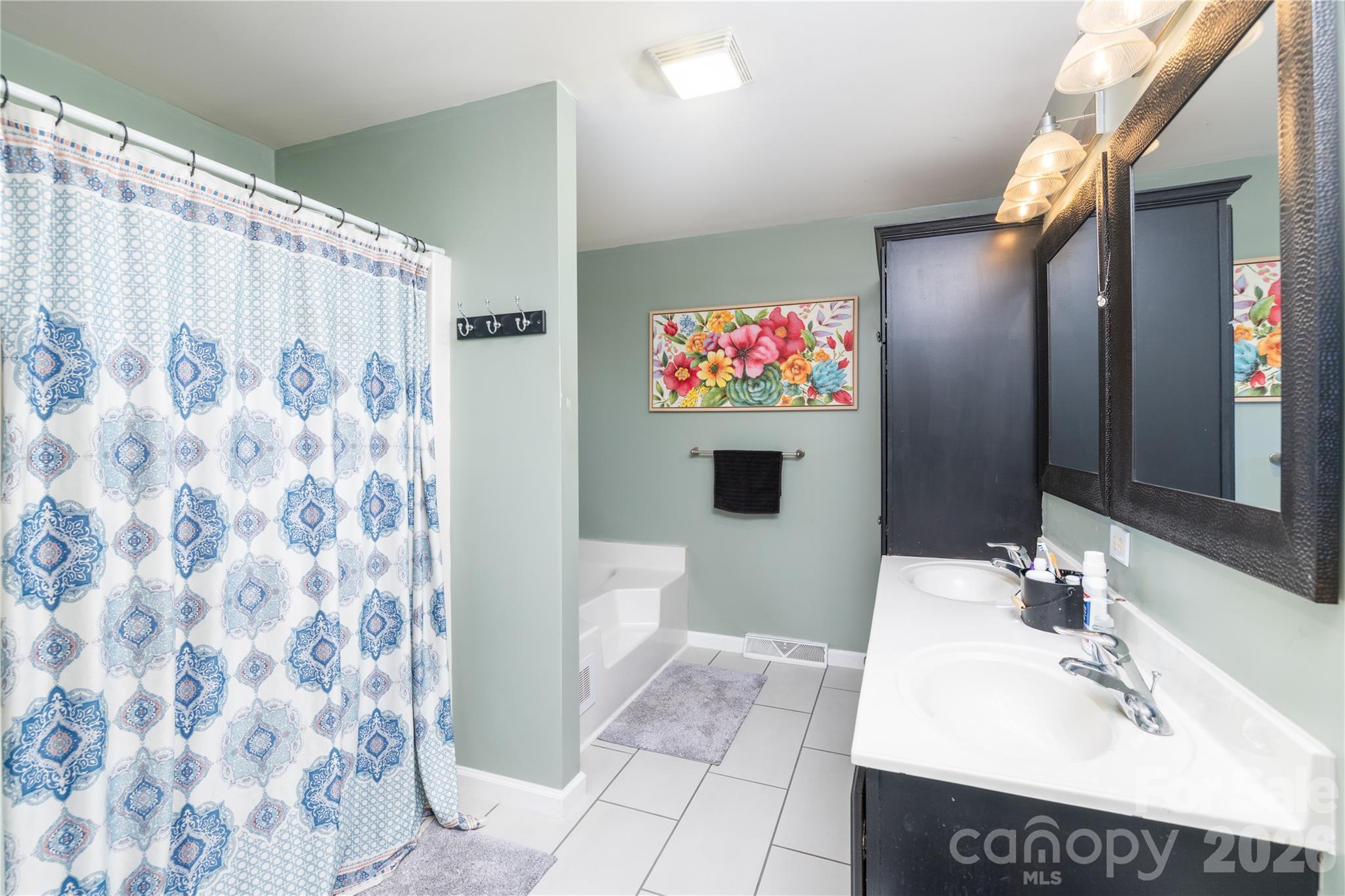 638 Acorn Acres Road Norwood, NC 28128 - Photo 12 of 23 a bathroom with a sink and a mirror