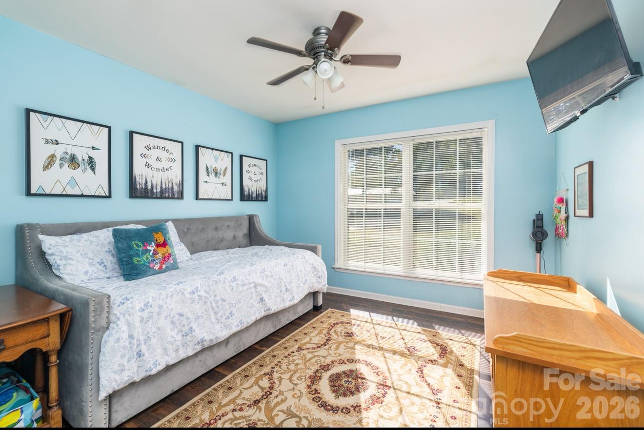638 Acorn Acres Road Norwood, NC 28128 - Photo 16 of 23 a bedroom with furniture and a large window