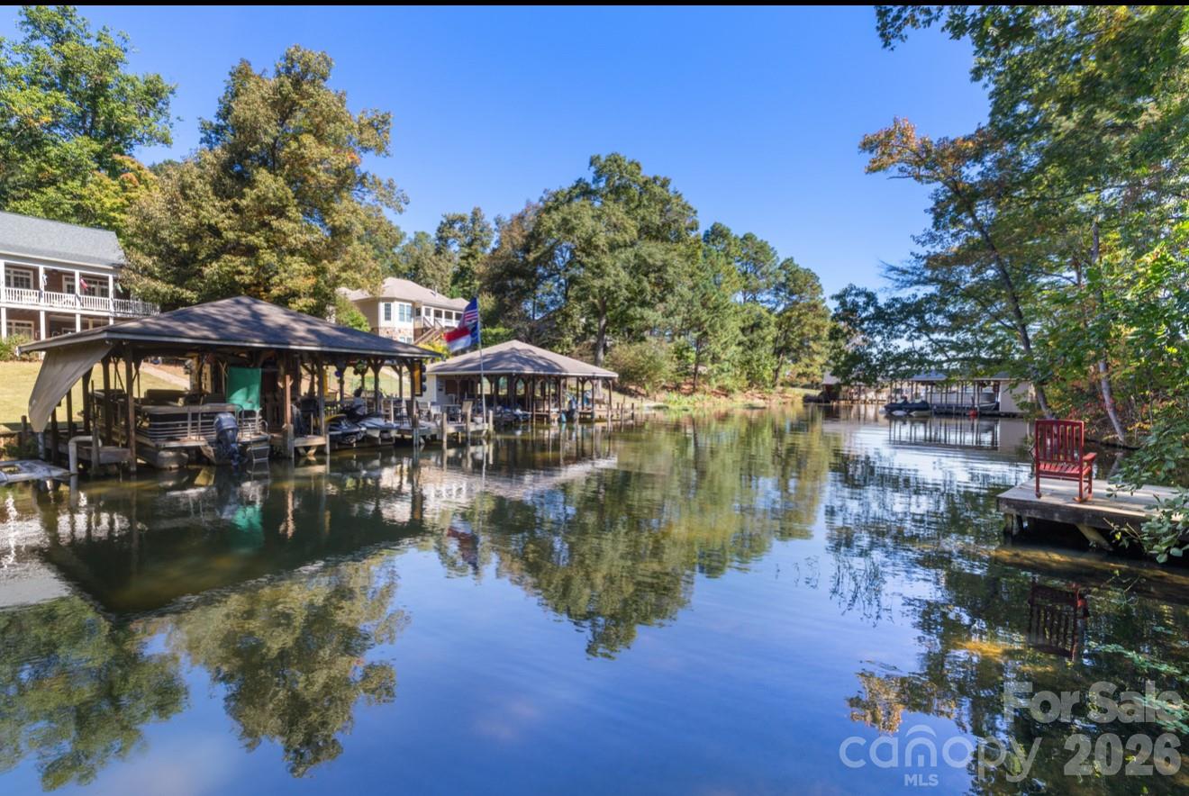 638 Acorn Acres Road Norwood, NC 28128 - Photo 20 of 23 a lake with lots of trees