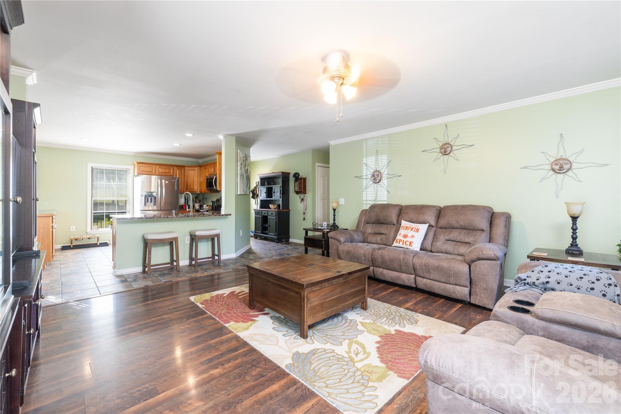 638 Acorn Acres Road Norwood, NC 28128 - Photo 8 of 23 a living room with couches and kitchen view with wooden floor