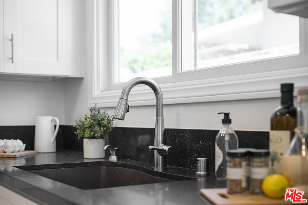 43 Kanan Road Oak Park, CA 91377 - Photo 22 of 42 a kitchen with a sink and a potted plant