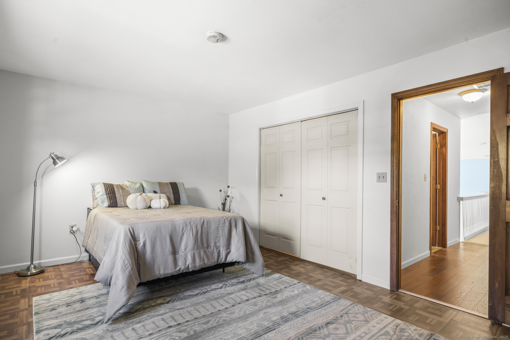 1165 Enfield Street, Unit 11 Enfield, CT 06082 - Photo 17 of 30 a bedroom with a bed and a view of closet