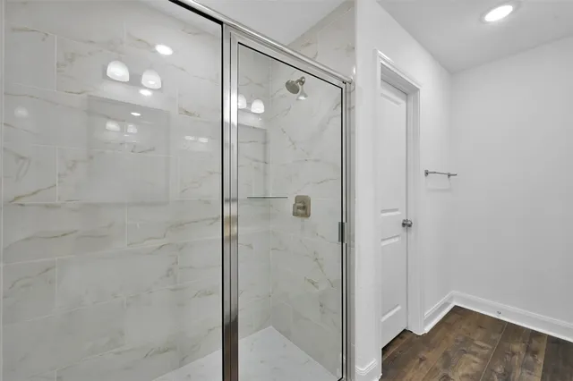 a bathroom with a shower and a sink