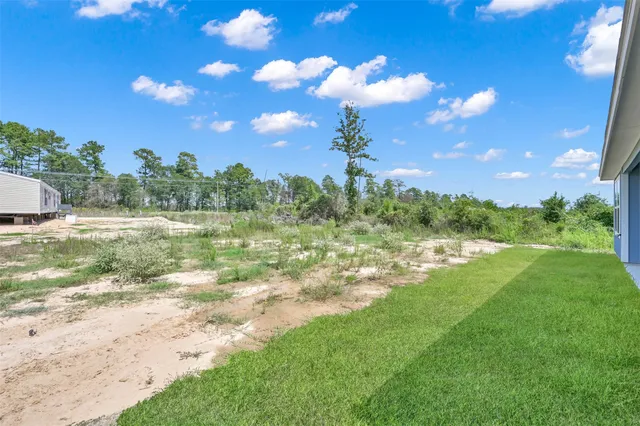 a view of a lake with a yard
